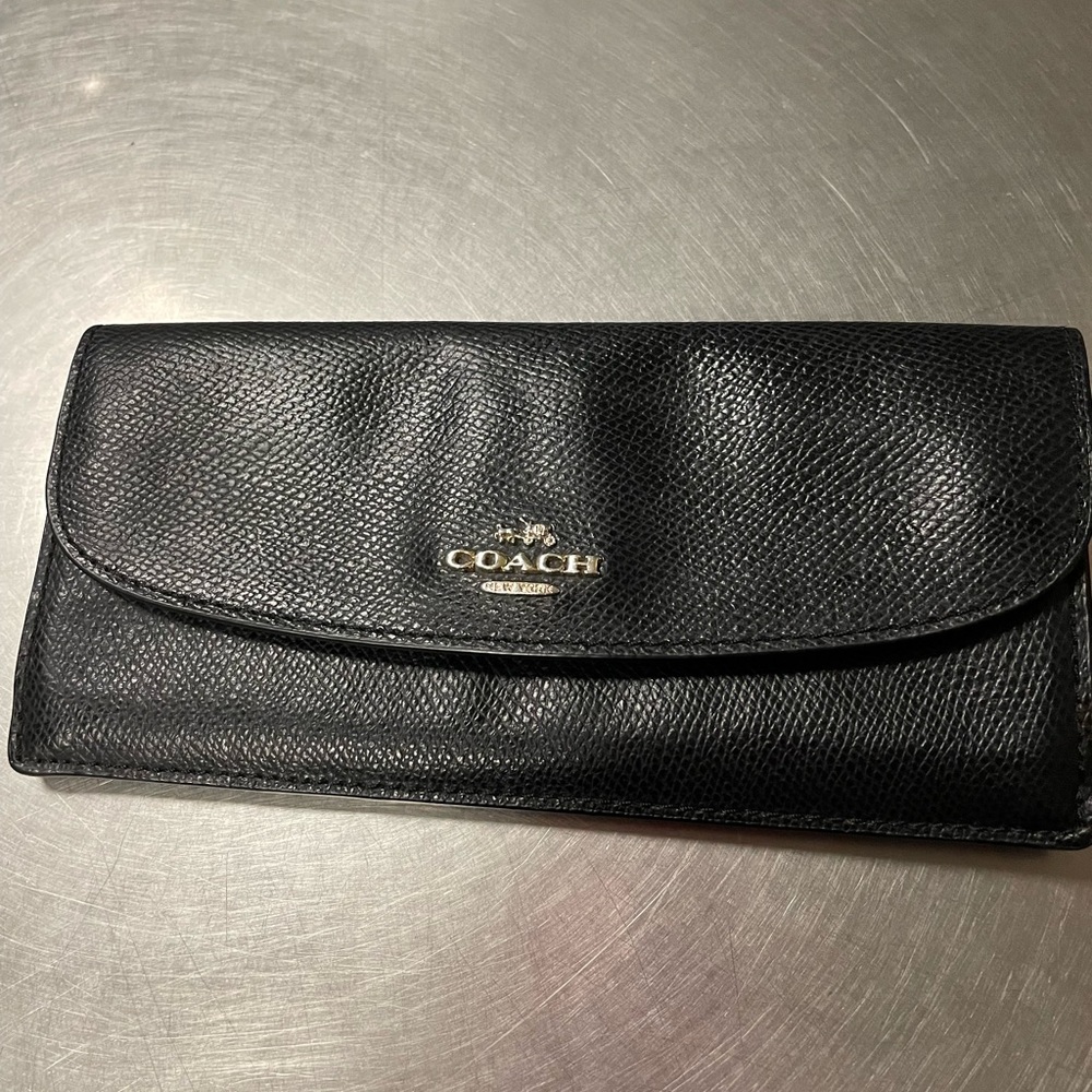 Selling a coach black authentic slim wallet